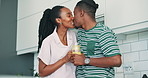 Love, kiss and happy black couple in a kitchen with orange juice, care or gut health morning routine at home. Wellness, support or African people bonding with vitamins, drink or breakfast smoothie