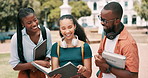 Textbook, conversation and students studying in outdoor park for university test, project or exam. Discussion, education and young friends reading information in research manual together at college.