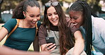 Women, friends and phone for university, college or campus gossip, social media and education website. Group of students relax at park and reading mobile for funny chat, contact and communication