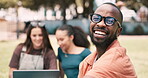 Students, black man and face on college or campus for education, happy learning and studying at park. Portrait of young person in glasses relax on grass for university opportunity and scholarship