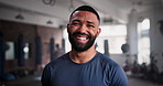 Fitness, face and happy man at a gym for morning workout, exercise or body challenge for wellness. Training, portrait and male personal trainer at a sports center for workout, goals or club coaching
