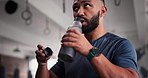 Fitness, bottle and man drinking water at gym for exercise, break or intense performance recovery. Hydration, drink and male person with sports liquid after training, exercise or workout challenge
