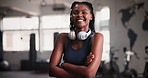 Fitness, face and happy black woman at gym with arms crossed confidence, good mood or positive attitude. Exercise, portrait and female athlete proud at sports center for training, wellness or workout
