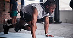 Fitness, plank and man running in gym for health, wellness and abdominal exercise for core training. Sports, motivation and African male athlete with stomach muscle workout for strength in studio.