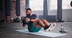 Black man, medicine ball and crunches in workout on floor for exercise, training or fitness at gym. Active African male person for muscle, strength or endurance in practice or stamina at health club