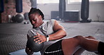 Black man, medicine ball and fitness for exercise, workout or training on floor at gym. Active African male person in crunches for muscle, strength or endurance in practice for stamina at health club
