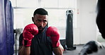 Strong man, boxing and person trainer in gym for fitness, workout and training in MMA, fight or target support. Young boxer and people coaching with pads for power, fist impact and exercise challenge