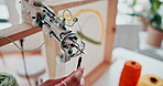 Needle, threading and wool in tool in workshop, hands and art class with safety in tuft studio. Design, student or learning a skill in fashion on machine or artist in creative project on handmade rug