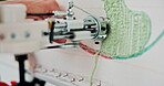 Hand, yarn and machine in workshop with tufting for carpet, creative design or embroidery at workplace. Business, closeup and designer with wool, manufacture or textile for handmade rug or weaving