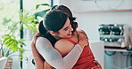 Woman, friends and happy hug at cafe for bonding connection or support, trust or reunion. Female people, smile and embrace in coffee shop for hangout or hello greeting for care, comfort or together