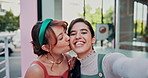Cafe, selfie and happy lgbt women kiss at table, love and laughing for social media post. Smile, digital photography and lesbian couple embrace at sidewalk coffee shop with pride, travel and memory.