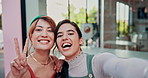 Cafe, selfie and happy lesbian women with peace sign at table, love and laughing for social media post. Smile, photography and lgbt couple hug at sidewalk coffee shop with pride, travel and memory.