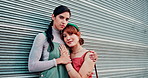 Lesbian women, couple and face in city with hug, pride and happy with gen z fashion for bonding in street. Girl, LGBTQ people and care with embrace, smile and portrait with style on urban sidewalk