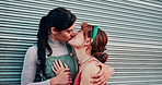 Women, lesbian and kiss or outdoor for happy relationship or lgbt community for diversity, connection or partnership. Female people, queer and embrace in city street or homosexual, equality or joy