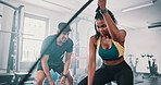 Gym, coach and black woman with battle rope wave for muscle growth, strength development and power exercise. Coaching, personal trainer and bodybuilder resilience in workout, challenge and endurance