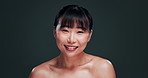 Skincare, face and happy Asian woman in studio with dermatology, shine or wellness on black background. Beauty, portrait and Japanese model touching glowing skin, results or anti aging treatment