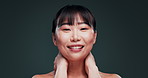 Korean, woman and happy with skincare, beauty and dermatology in dark background of studio or mockup. Facial, cosmetics and makeup for healthy and natural glow on skin from self care or treatment