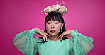 Face, beauty and happy woman with flower crown in hair at studio isolated on a pink background. Portrait, wreath and floral cosmetics of natural Korean model in organic skin makeup, fashion or smile