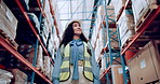 Woman, logistics and inspection of inventory in warehouse for quality, trade and distribution. Female foreman, hardhat and walking in factory for assurance, survey or control of stock from low angle