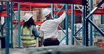 Man, woman and walking in warehouse for inspection of package or supply chain logistics, import or storage. Colleagues, clipboard and checklist as factory distribution or shipping, delivery or parcel
