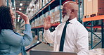 Team, engineer and high five in warehouse with tablet for success, shipping or smile. Celebration, mature black man and factory supervisor with achievement, winning or cheers for inventory management