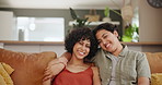 Lesbian, couple and face with hug in living room on sofa of home for bonding, relationship and love. Lgbtq, people and portrait with embrace on couch in lounge for trust, happy and care in apartment