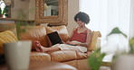 Laptop, search and happy woman on a sofa with social media, streaming or comic video at home. Pc, typing and female person relax in a living room for me time, movies or online comedy show in a house