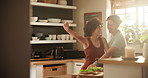 Lesbian, couple and dancing in kitchen, happiness for love and gay relationship, pride and rhythm while cooking together. Laughing, playful and music, women at home for fun with commitment and lgbtq 