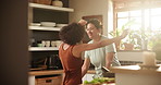 Happy woman, lesbian couple and dancing in kitchen for fun holiday weekend or bonding at home. Female person, LGBT or gay people enjoying music, cooking or celebration in joy or relationship at house