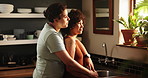 Happy woman, lesbian couple and hug in kitchen for love, romance or bonding together by window at home. Female person, LGBT or gay people with smile for embrace, trust or support in care at house