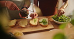 Hands, avocado and bread in kitchen for sandwich on table for health, diet and wellness for breakfast in home. People, toast and prepare lettuce for nutrition, vegan meal and knife for food in house