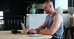 Laptop, research and man in office typing on internet for creative project or online email. Technology, notebook and young male freelance writer working on content with computer in workplace.