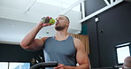 Exercise, health and hydration with man drinking water in gym for break or recovery from workout. Fitness, sports or wellness and confident young bodybuilder with glass bottle for drink at training