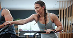 Fitness, spin class and woman in gym for cardio training, intense workout and exercise for health. Sports, sweating and people on cycling equipment or machine for performance, endurance and wellness