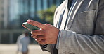 Businessman, phone and hands typing for social media, communication or chatting in city. Closeup of man or employee scroll on mobile smartphone for online texting, research or app in an urban town