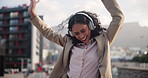 Dance, celebration and woman in city with headphones, excited energy and streaming music in Cape Town. Happy, lady and girl with headset outdoor, listening to radio and relax with audio in morning