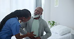 Senior care, nurse and black man with pain in abdomen for advice, healthcare and exam on bed. Homecare, stomach and mature person with caregiver in consultation for medical assessment, check or help.