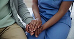 Hands, caregiver and compassion for senior person, kindness and support in consultation at home. Closeup, trust and holding hands for empathy in retirement, nurse and helping with elderly care