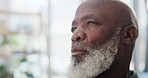 Senior man, thinking and depression in living room, nostalgia and regret for remembering memories. Black elderly person, nursing home and contemplating choice or decision, sad and doubt in retirement