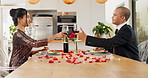 Couple, home and toast with red wine for celebration of love, romance and valentines day on their anniversary. Happy man and woman on date with glasses, drinks and red champagne for success or luxury