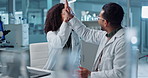 Science, teamwork and high five with laptop in laboratory for test breakthrough, pharmaceutical review or excited. Scientist, collaboration or mentor for research success, talking or digital analysis
