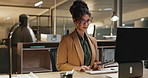 Business, night or woman with glasses on computer in office for startup research, planning or typing schedule. Working late, deadline or entrepreneur online for project, search or email communication