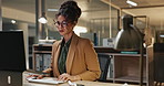 Business, night or woman with glasses on computer in office for startup research, planning or typing schedule. Working late, deadline or entrepreneur online for project, search or email communication