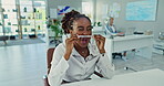 Woman, pen on nose and playing in office with laughing or silly, goofy and funny at corporate workplace. Employee, black person and comedy at company desk with humor, crazy and confidence for fun