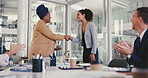 Business woman, shaking hands and applause for award, achievement or success. Clapping, handshake or reward for winning, congratulations and happy team of people celebrate promotion in office meeting