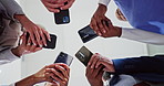 Doctor, phone and hands typing below for social media, networking or research together at hospital. Low angle of medical employees, team or group on mobile smartphone for online chatting or texting