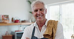 Man, smile and confident with apron in kitchen for cooking, cleaning or preparing meal in house. Elderly person, arms crossed and happy in house for food, hobby and retirement in modern home scullery