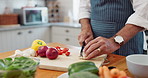 Cooking, hands and man with healthy food for salad, nutrition and cutting fresh ingredients for lunch. Diet, vegetables and home chef at kitchen counter with knife, recipe and meal prep for dinner.