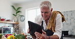 Tablet, search and senior man cooking in a kitchen with online recipe, meal prep or vegetable ingredient check. Digital, app and old male person having fun in retirement with food, blog or brunch