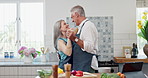 Couple, kitchen and dance with love, trust and support for communication, celebration and retirement. Senior people, smile and cooking for conversation, hug and commitment with holiday or vacation